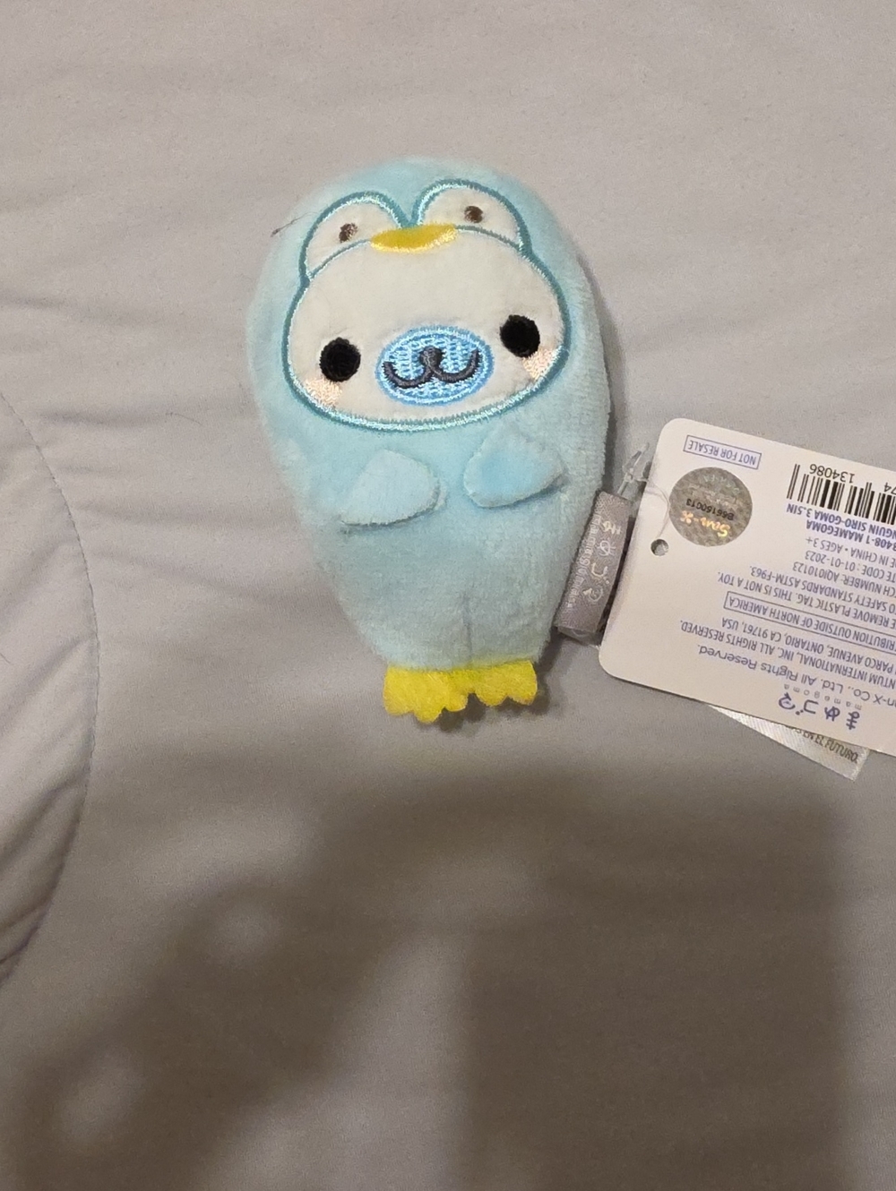 Blue Plush Small Toy with Yellow Accents